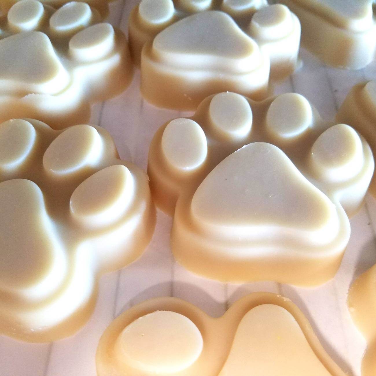 Natural Goat Milk Soap Dog Shampoo Bar Big Paw shaped like puppy paw pads, showcasing its unique design for pet grooming.