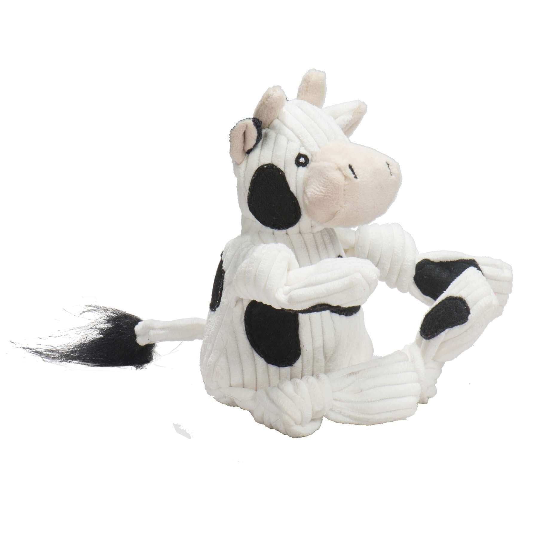 Dottie Cow Knottie Plush Dog Toy sitting pose, designed for durability and fun for dogs and puppies.