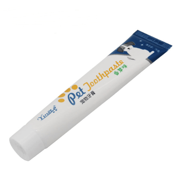 Dog Toothpaste by Dog Hugs Cat in a white tube with colorful branding for pet dental care.