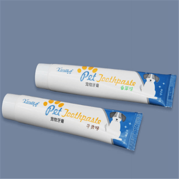 Dog Toothpaste by Dog Hugs Cat, featuring two tubes of dental care for pets.