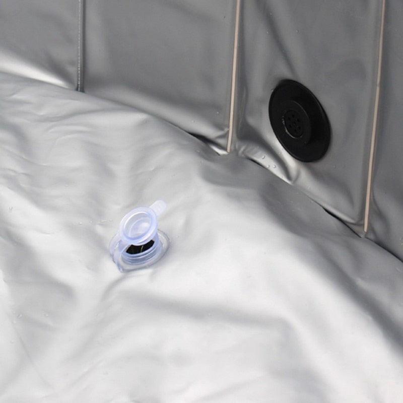 Close-up of the drain and valve in the Dog Foldable Pool Portable Swimming Pool, showcasing its waterproof design.