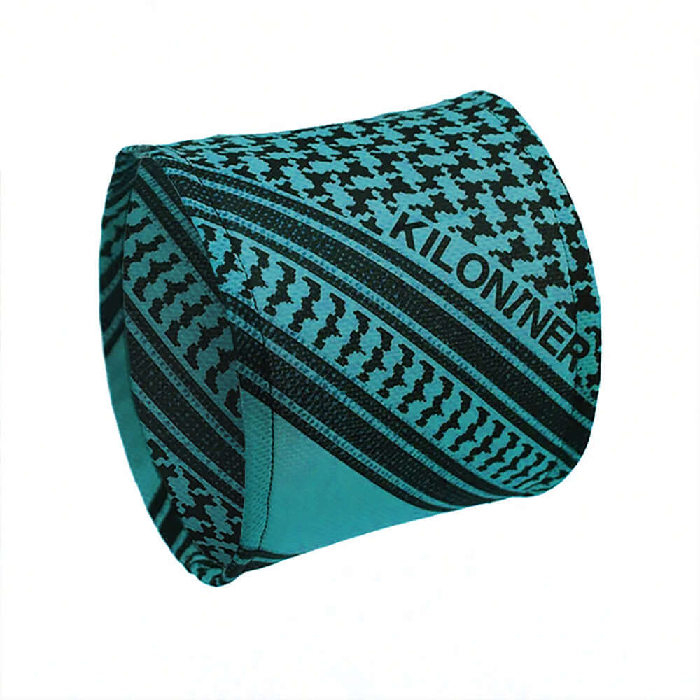 Cooling Shemagh Scarf for Dogs in teal with black patterns for keeping pets cool in hot weather.